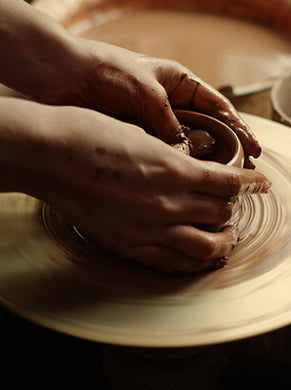 A bowl being shaped from clay